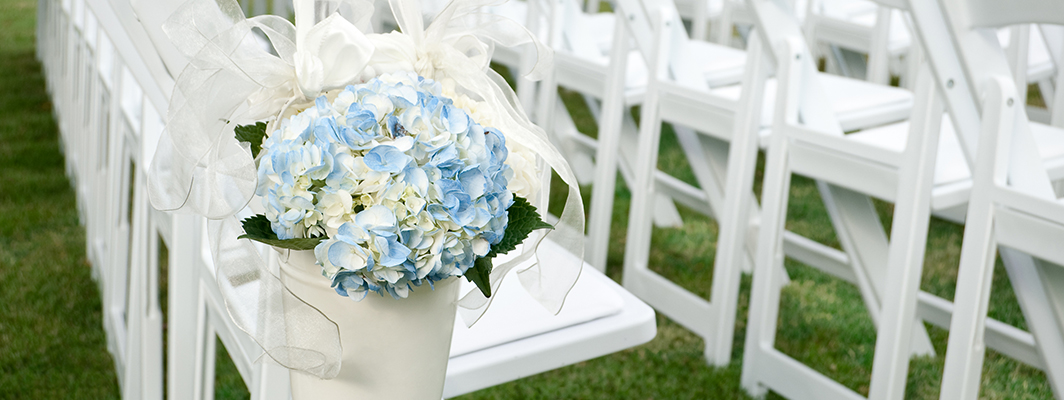 the wedding aisle with flowers.