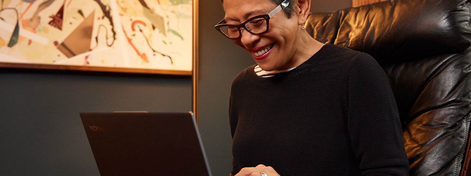 A person smiling at a Surface device