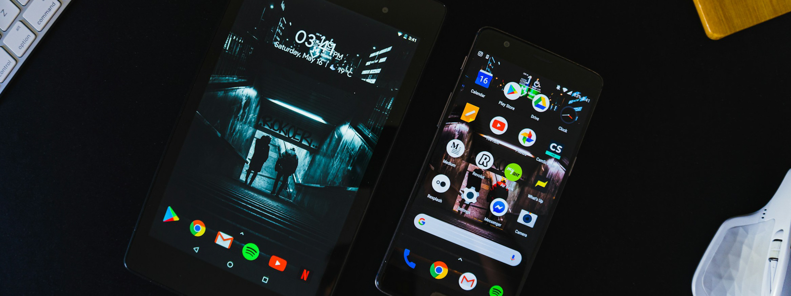 A phone and a tablet on a table