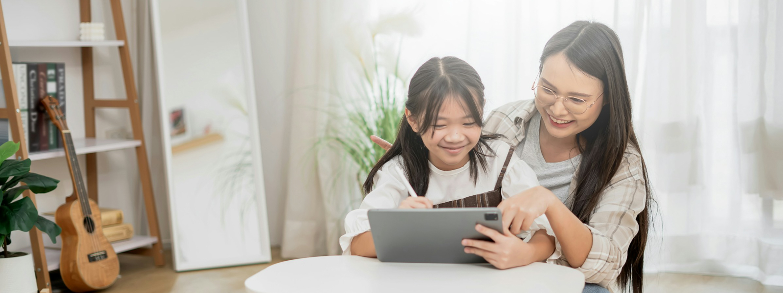 Mother and daughter using a tablet