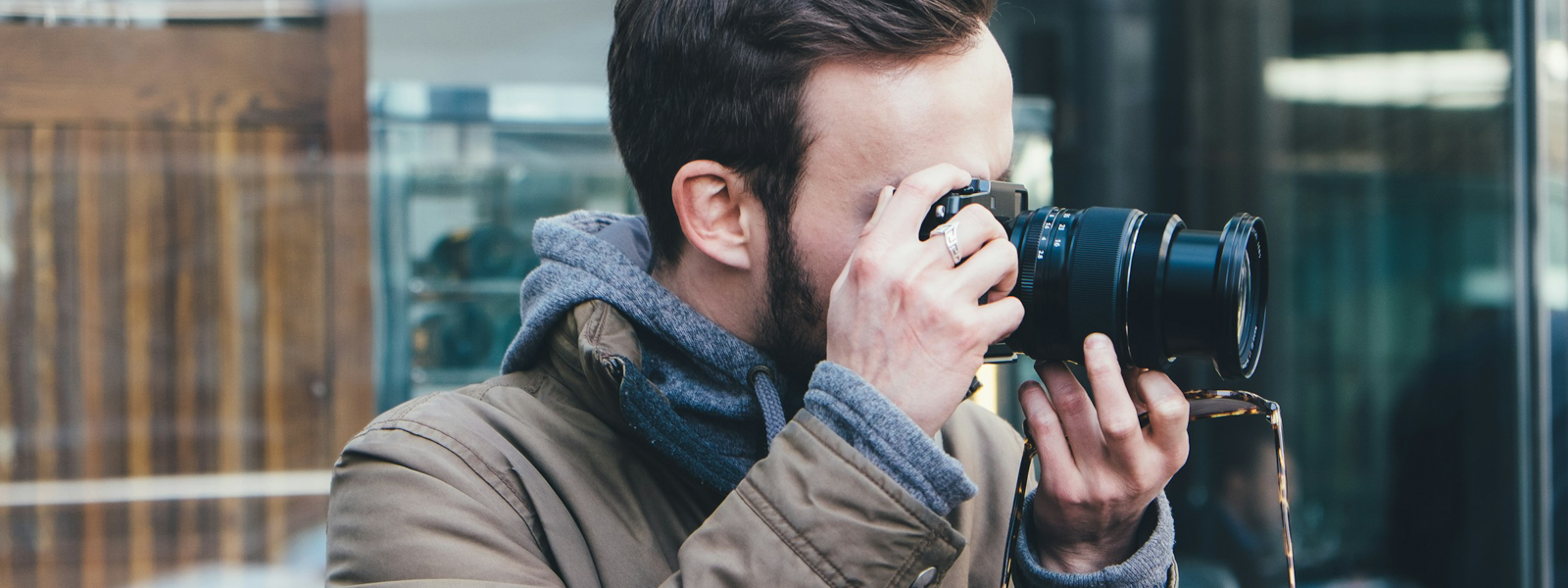 Man taking a photo on his digital camera