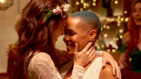 Two just married women having their first dance at the wedding party