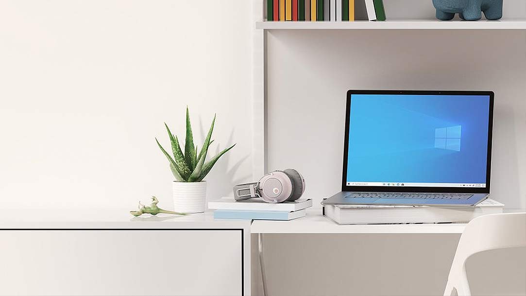 a tv monitor on a desk in a bedroom