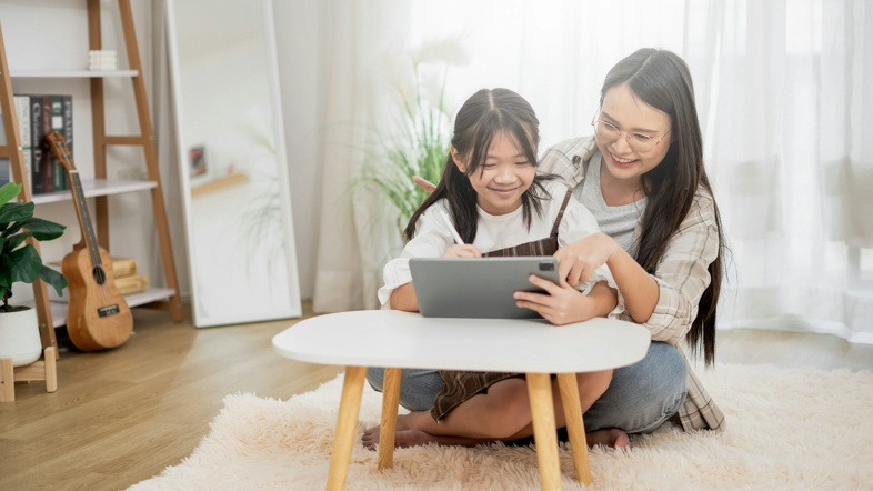 Mother and daughter using a tablet