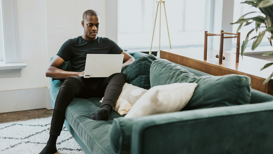 man using computer at home